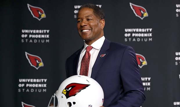 New Arizona Cardinals NFL football head coach Steve Wilks poses for photographers, Tuesday, Jan. 23...