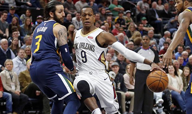 New Orleans Pelicans guard Rajon Rondo (9) drives around Utah Jazz guard Ricky Rubio (3) in the fir...