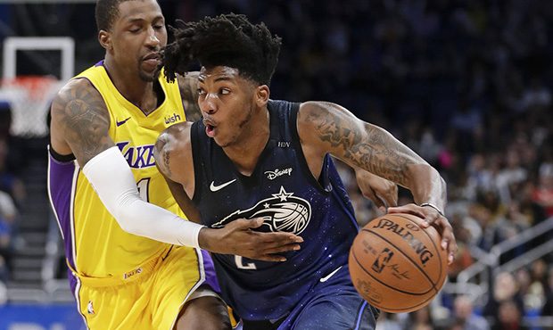 Orlando Magic's Elfrid Payton, right, drives around Los Angeles Lakers' Kentavious Caldwell-Pope, l...