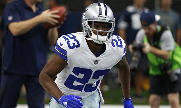 Dallas Cowboys cornerback Bene Benwikere (23) warms up before an NFL football game against the Gree...