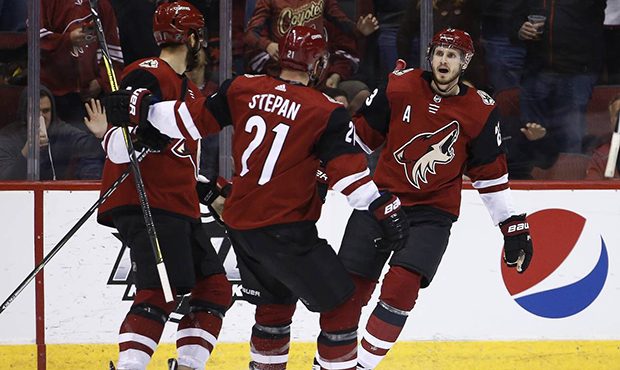 Arizona Coyotes defenseman Oliver Ekman-Larsson (23) celebrates his goal against the Ottawa Senator...