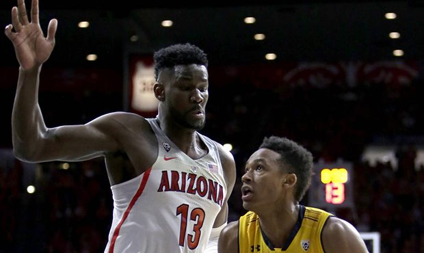 California forward Roman Davis drives on Arizona forward Deandre Ayton (13) during the first half o...
