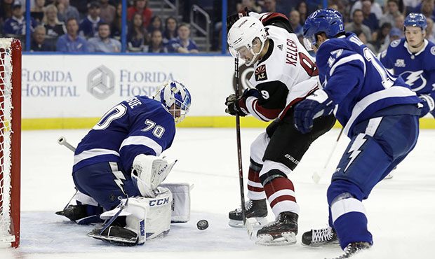 Arizona Coyotes center Clayton Keller (9) shoots against Tampa Bay Lightning goaltender Louis Domin...