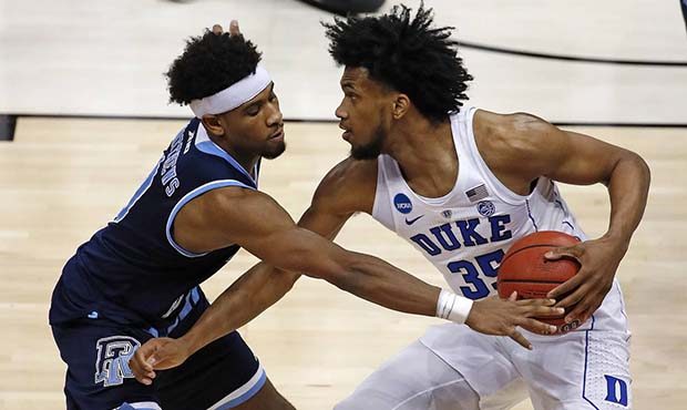 Duke's Marvin Bagley III (35) is defended by Rhode Island's E.C. Matthews during the second half of...