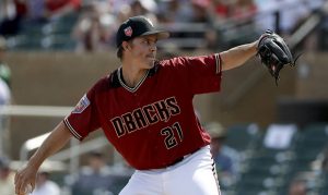 Diamondbacks' Zack Greinke reports to Spring Training