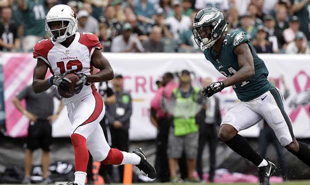 Arizona Cardinals' John Brown, left, scores a touchdown past Philadelphia Eagles' Jalen Mills durin...