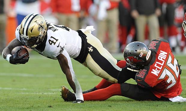 New Orleans Saints running back Alvin Kamara (41) dives away from Tampa Bay Buccaneers defensive ba...