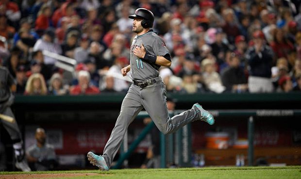 Arizona Diamondbacks' A.J. Pollock runs home to score on a sacrifice by Daniel Descalso during the ...