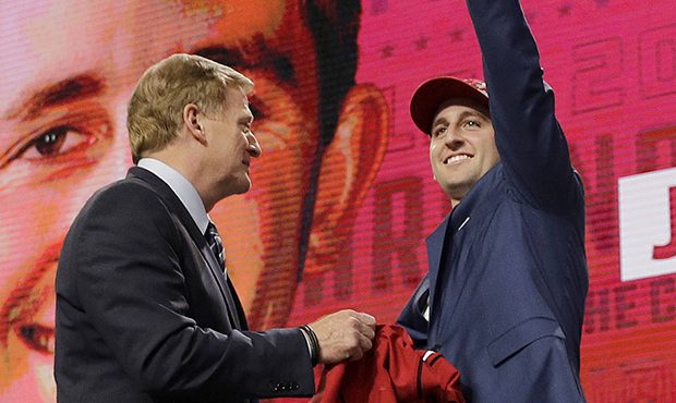 UCLA's Josh Rosen, right, gestures next to commissioner Roger Goodell after being selected by the A...