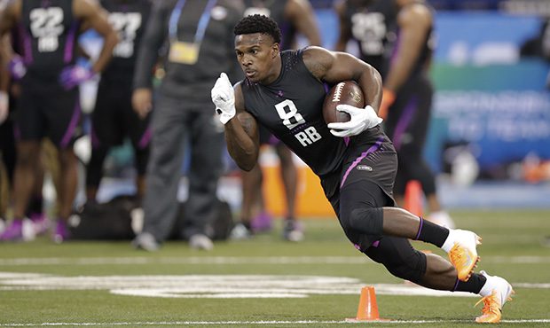 Fordham running back Chase Edmonds runs a drill at the NFL football scouting combine in Indianapoli...