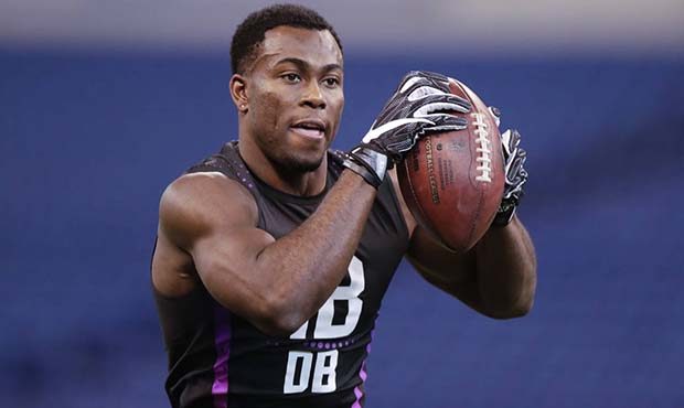 Iowa defensive back Josh Jackson runs a drill at the NFL football scouting combine in Indianapolis,...