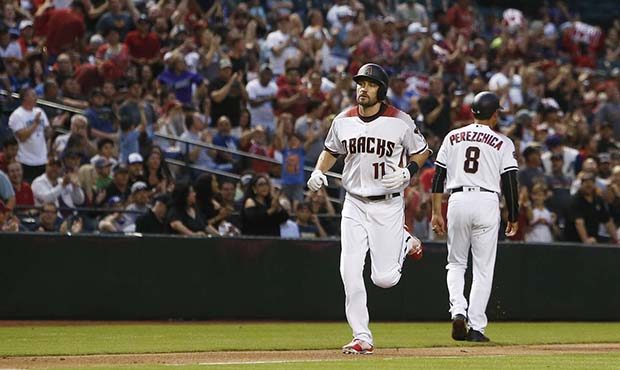 Arizona Diamondbacks' A.J. Pollock (11) rounds the bases after celebrating his home run against the...