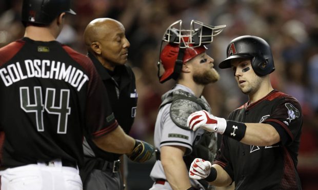 Arizona Diamondbacks' Chris Owings celebrates with Paul Goldschmidt (44) after hitting a three-run ...