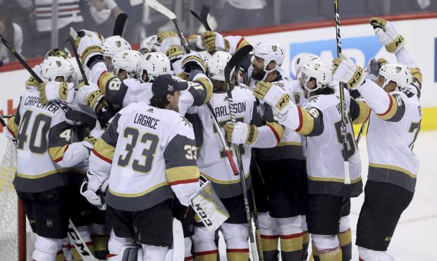 The Vegas Golden Knights mob goaltender Marc-Andre Fleury (29) after defeating the Winnipeg Jets du...