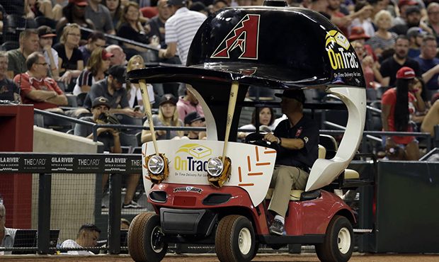 The Arizona Diamondbacks' bullpen cart is driven on the warning track during the eighth inning of t...