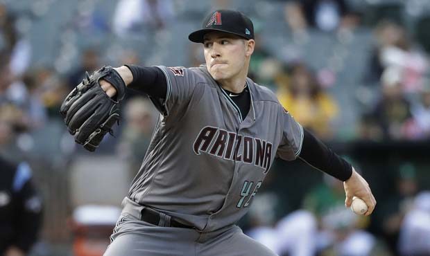 Arizona Diamondbacks starter Patrick Corbin throws to an Oakland Athletics batter during the first ...