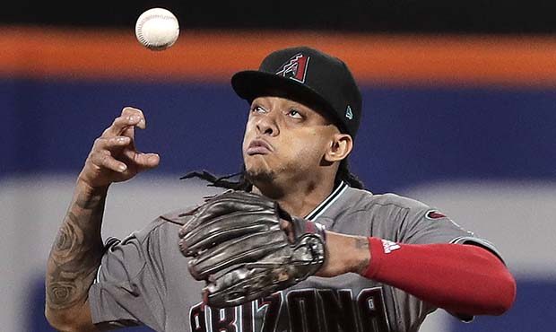 Arizona Diamondbacks shortstop Ketel Marte (4) cannot handle a ground ball hit by New York Mets' Mi...