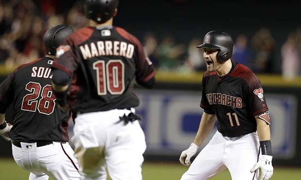 Arizona Diamondbacks' A.J. Pollock (11) celebrates with Steven Souza, left, and Deven Marrero after...