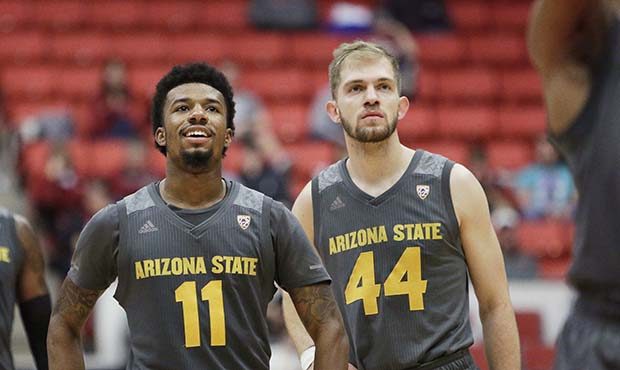 Arizona State forward Romello White (23), guard Shannon Evans II (11) and guard Kodi Justice (44) w...