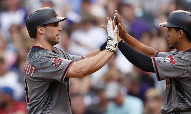 Arizona Diamondbacks' Paul Goldschmidt, left, is congratulated by Jon Jay after Goldschmidt hit a t...