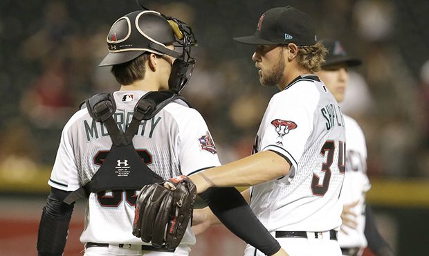 Arizona Diamondbacks' Braden Shipley (34) and John Ryan Murphy celebrate after defeating the Pittsb...