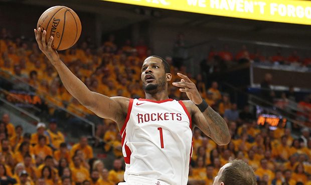 Houston Rockets forward Trevor Ariza (1) lays the ball up as Utah Jazz forward Joe Ingles (2) defen...