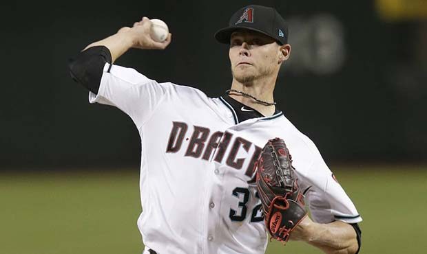 Arizona Diamondbacks pitcher Clay Buchholz throws during the first inning of the team's baseball ga...