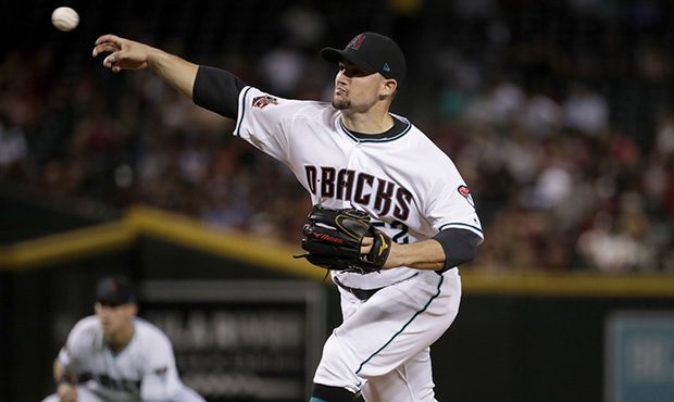 Arizona Diamondbacks starting pitcher Zack Godley (52) throws against the New York Mets during the ...
