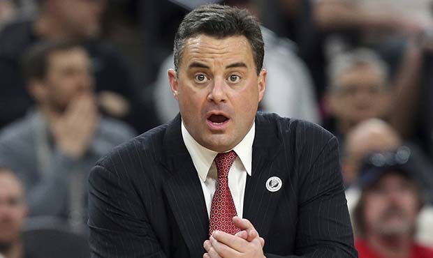 Arizona coach Sean Miller talks to his team during the first half against UCLA in an NCAA college b...
