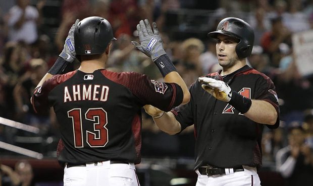 Arizona Diamondbacks' Paul Goldschmidt celebrates with Nick Ahmed (13) after hitting a three-run ho...