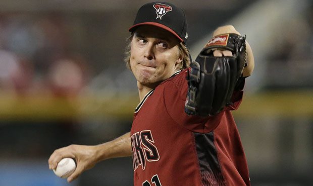 Arizona Diamondbacks' pitcher Zack Greinke throws in the first inning during a baseball game agains...