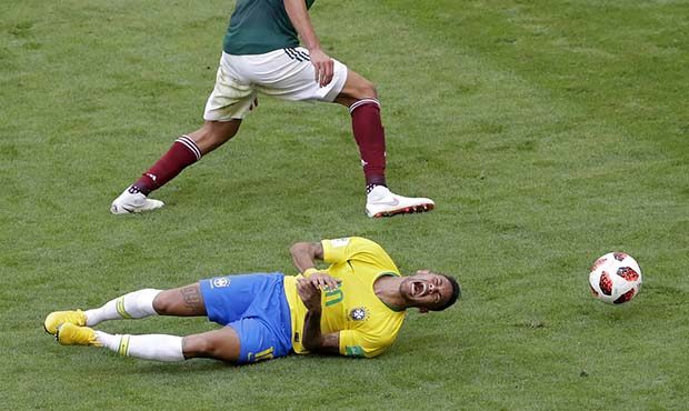 Brazil's Neymar, bottom, challenges for the ball with Mexico's Edson Alvarez during the round of 16...