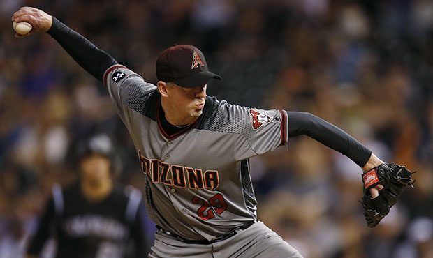 Arizona Diamondbacks relief pitcher Brad Ziegler throws a pitch to Colorado Rockies' Trevor Story i...