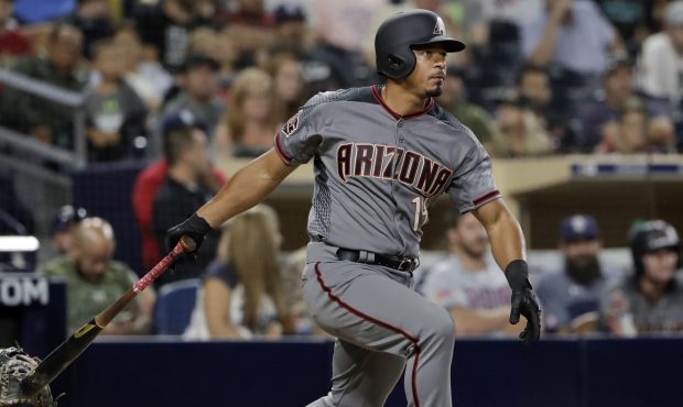 Arizona Diamondbacks' Eduardo Escobar watches his double during the ninth inning of the team's base...