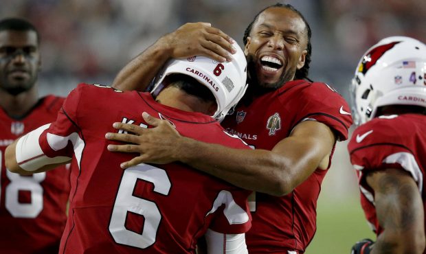 Arizona Cardinals wide receiver Larry Fitzgerald (11) hugs quarterback Chad Kanoff (6) after a touc...
