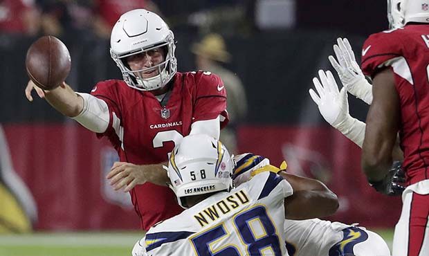 Arizona Cardinals quarterback Josh Rosen (3) gets the pass off as Los Angeles Chargers linebacker U...