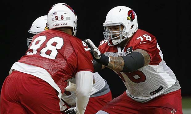 Arizona Cardinals offensive guard Mike Iupati (76) blocks defensive tackle Corey Peters, right, dur...