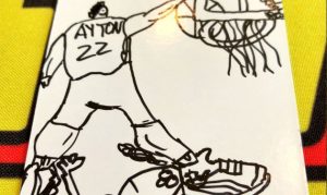 It looks like Deandre Ayton drew a picture of himself dunking on Embiid
