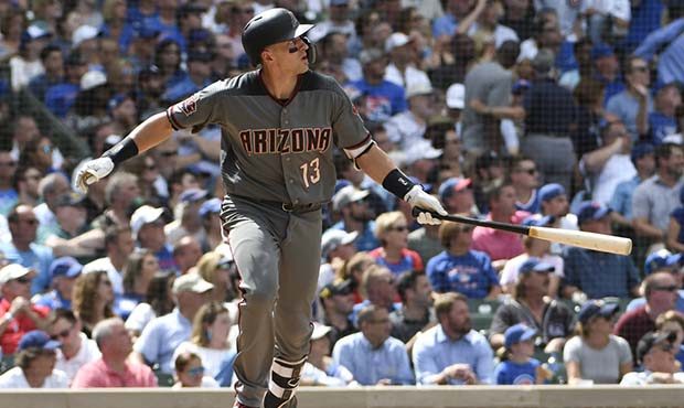 Arizona Diamondbacks' Nick Ahmed (13) watches his grand slam during the fifth inning of a baseball ...