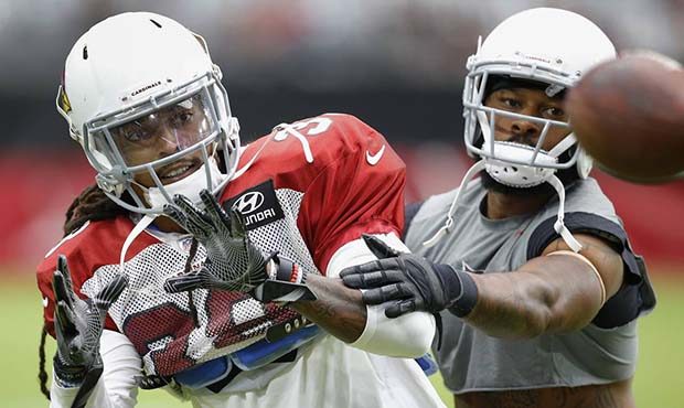 Arizona Cardinals defensive back Tre Boston, left, works with defensive back Antoine Bethea, right,...