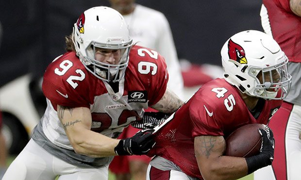 Arizona Cardinals linebacker Dennis Gardek (92) stops running back Sherman Badie (45) during an NFL...