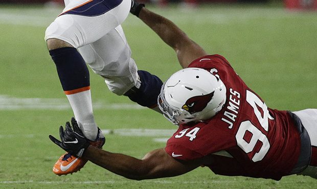 Denver Broncos quarterback Chad Kelly throws under pressure from Arizona Cardinals defensive end Al...