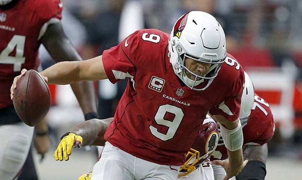 Arizona Cardinals quarterback Sam Bradford (9) is tackled by Washington Redskins defensive tackle T...
