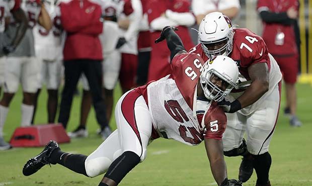 Arizona Cardinals defensive end Chandler Jones (55) and linebacker D.J. Humphries (74) run drills a...