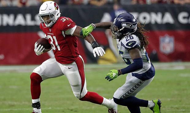 Arizona Cardinals running back David Johnson (31) eludes Seattle Seahawks cornerback Shaquill Griff...