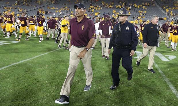 Arizona State head coach Herm Edwards walks to midfield following a 49-7 victory against UTSA durin...