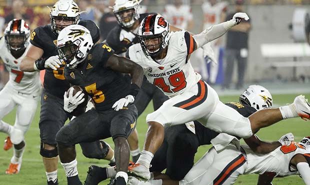 Arizona State running back Eno Benjamin (3) carries as Oregon State linebacker Andrzej Hughes-Murra...
