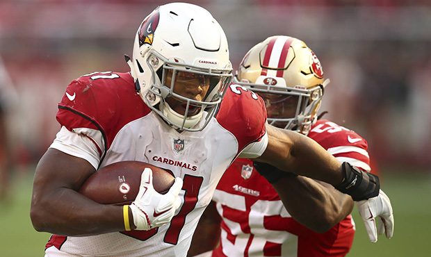 Arizona Cardinals running back David Johnson, left, runs in front of San Francisco 49ers linebacker...