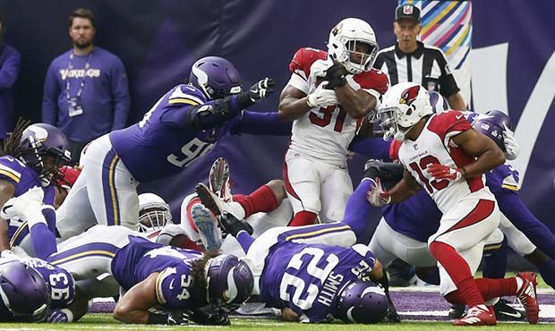 Arizona Cardinals running back David Johnson (31) scores on a 1-yard touchdown run ahead of Minneso...