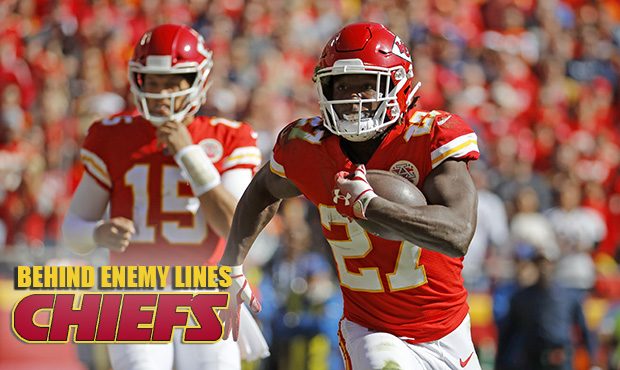 Kansas City Chiefs running back Kareem Hunt (27) carries the ball away from quarterback Patrick Mah...